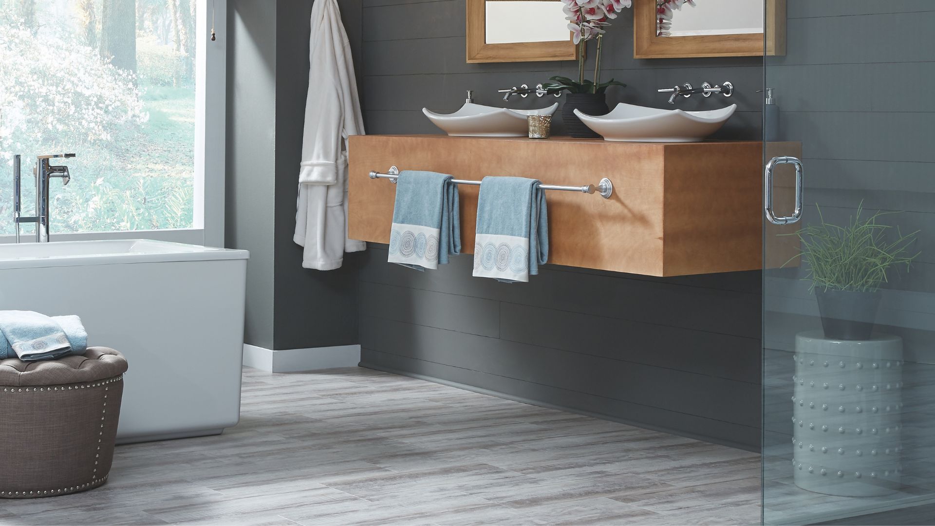 wood look tile flooring in a stylish Marrero bathroom design 